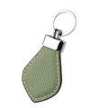 Close-up of green pebble leather keychain with white stitching and silver metal ring - Light Green
