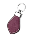 Detail of burgundy lychee leather keychain with white hand-stitching and silver ring - Purple