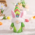 Lighted Easter gnome with pink bunny ears and green knit suit on white plush background - Striped / Green