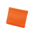 Close-up of orange pebble leather coin pouch with spring metal closure and neat stitching - Orange