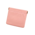 Detailed view of pink pebble grain leather coin purse with golden metal squeeze closure - Pink