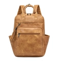 Detail of vintage brown PU leather backpack featuring tassel zippers and side pockets - Apricot
