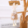 Easter bunny plush hanging decoration with long ears and white flower in warm cream tones - Brown