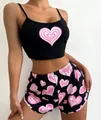 Women's pajama set featuring black camisole crop top and shorts with pink heart prints - S / Black With Big Hearts