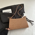 Minimalist straw woven shoulder bag in tan with black and white striped detail - Brown with Pendant