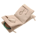 Macro detail of apricot velvet jewelry roll showing multiple zippered storage compartments - Pink