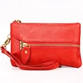Red lychee grain leather wristlet wallet with gold zipper and a matching leather strap - Red