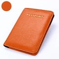Bright orange leather passport holder with golden gold-stamped letters and neat stitching - Orange