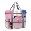 Detail view of large white mesh beach bag with functional side pockets and grey handles - 42*38*20cm / White