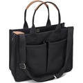 Detail of black canvas tote bag showing front pockets and brown leather handle wrap - Black