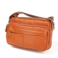 Brown top grain leather crossbody bag featuring multiple zippers and adjustable strap - Orange