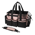 Detalle de bolsa de limpieza portátil con asa, correa ajustable y bolsillos de malla - 24.4x38.1x23.1cm / Rosa