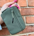 Close-up of olive green nylon coin purse with dual zippers and paracord pullers - 15*9*2cm / Army Green