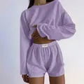 Detail of lavender knit two-piece set showing breathable hollow texture and elastic waist - Purple