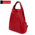 Small red pebble leather backpack featuring geometric stitching and silver rivets - Small / Red