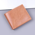 Classic brown bifold wallet for men with textured leather finish and precise stitching - Tan