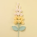 Macro detail of handmade crochet lilac flowers with yellow and cream color gradient - Gradient Yellow