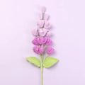 Detailed texture of purple crochet lilac flowers with green leaves on light background - Gradient Purple