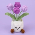 Detailed view of handmade purple crochet tulip in a white pot with a cute smiling face - Gradient Purple 4 Tulips (White Pot with Feet)
