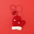 Detail of red crochet mini glove pendant with white snowflakes and festive bell - Snowflake Glove (Red Bell)