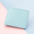 Slim bi-fold women's wallet in light mint green faux leather with textured finish - Blue