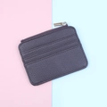 Close-up of slim dark purple PU leather card holder with three slots and gold zipper - Dark Coffee