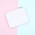 Close-up of white lychee pattern PU leather card holder with silver metal zipper and card slots - White