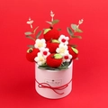 Handmade crochet apple flower bouquet in a white gift box with red festive background - Apple Style Gift Bucket