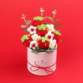 Detail of handmade crochet strawberry bouquet in a pink gift box with a red bow - Strawberry Style Gift Bucket