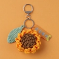 Detail of crochet sunflower keychain with green leaves and engraved acrylic tag charm - Sunflower (Round Ring)