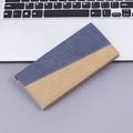 Slim minimalist canvas long wallet with blue and brown patchwork design on gray desk - Blue Color Block