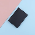 Slim black faux leather card holder with white stitching and litchi texture - Black