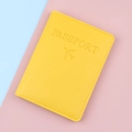 Yellow PU leather passport holder with embossed airplane icon and RFID protection - Yellow