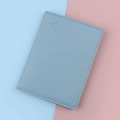 Light blue faux leather passport holder with embossed airplane icon and litchi texture - Blue