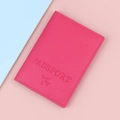 Hot pink leather passport cover with embossed lettering on a soft pastel background - Rose Red