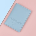 Minimalist light blue faux leather passport cover with embossed airplane design - Blue