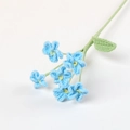 Macro detail of hand-crocheted forget-me-not flowers with blue petals and yarn texture - Forget-Me-Not Branch / Blue