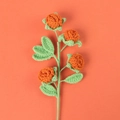 Handmade crochet orange rose with four flowers and green leaves on orange background - 4-Head / Orange
