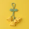 Handmade crochet lily of the valley keychain with four yellow flowers and green leaves - Yellow