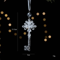 Clear acrylic key-shaped Christmas ornament with intricate cutout patterns and white ribbon - Vintage Keys