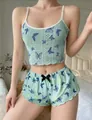 Detail of mint green pajama set with butterfly print, lace texture and black bow - Mint Green Butterfly Print