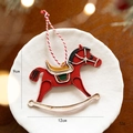 Vintage red metal rocking horse Christmas ornament with festive red and white hanging string - Red Rocking Horse