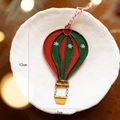 Vintage red and green metal hot air balloon Christmas ornament with snowflake details - Red and Green Hot Air Balloon
