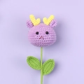Detailed knit texture of a purple crochet deer doll on a green stem for kids gift - Purple Deer Style