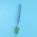 Macro detail of handmade crochet lavender flower with intricate light blue yarn texture - Blue