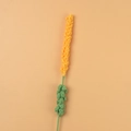 Macro detail of a handmade crochet lavender stem in bright yellow yarn for home decor - Orange