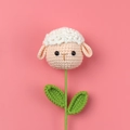 Detail of handmade crochet sheep head flower with green leaves for gift bouquets - Sheep Style