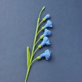 Detailed texture of blue hand-crocheted freesia flower with five petals on dark background - Meng Si Freesia (6 Flowers) / Sapphire Blue