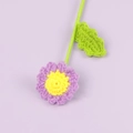 Close-up of handmade crochet daisy flower with purple petals and yellow center - Finished Small Daisy Bouquet (Light Purple)