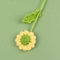 Close-up of handmade crochet sunflower petals and detailed yarn texture in soft light - Green Core Yellow Border Daisy Bouquet